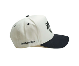 2000s hip hop hat in cream and black featuring 3D embroidered design and 'WEAR THE ERA' text.