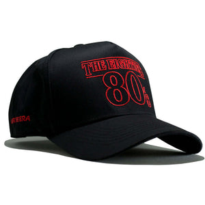 80s Retro Snapback – The Eighties Black/Red Limited Edition Hat showcasing bold red lettering on a black cap.