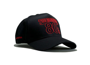80s Retro Snapback – The Eighties Black/Red Limited Edition Hat showcasing bold red lettering on a black cap.